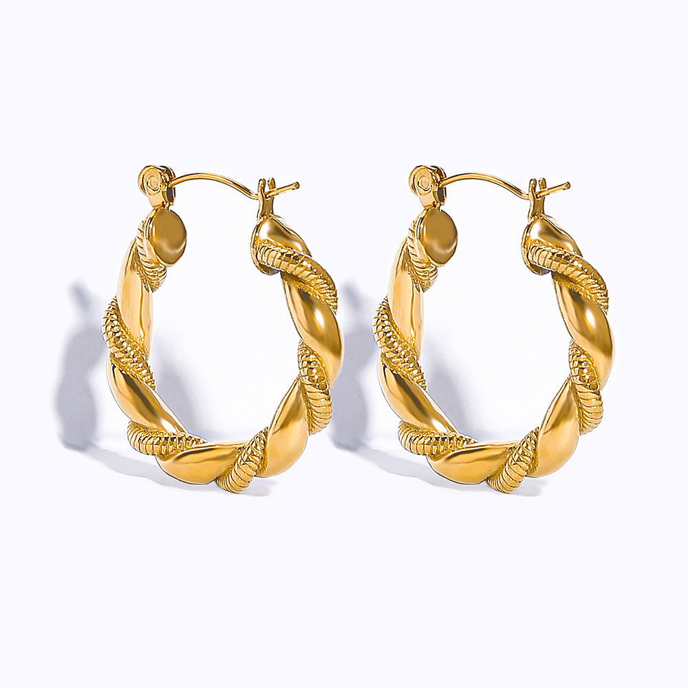 Boucles d'oreilles en acier titanium plaqué or en forme de croissant creux, élégantes et modernes.