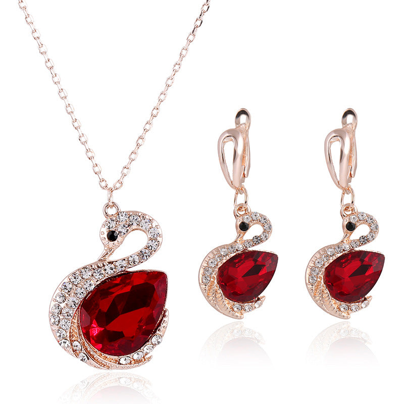 Ensemble de bijoux en cristal coréen, collier et boucles d'oreilles, avec pendentifs en cristal clair et détails élégants.