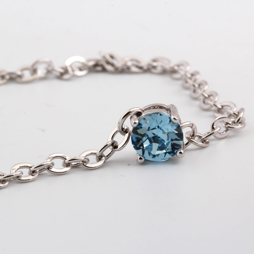 Bracelet en cristal autrichien plaqué platine pour femmes, bijoux élégant avec cristaux brillants et finition raffinée.