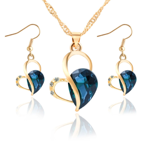 Ensemble de bijoux en perles en forme de cœur avec boucles d'oreilles en goutte d'eau, élégant et sophistiqué.