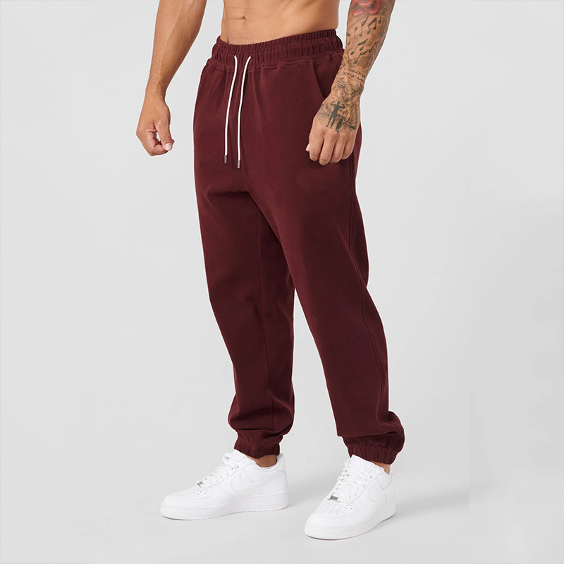 Pantalon de survêtement de sport Track Sweatpants de la marque Boutique Anenor, en tissu noir avec poches et taille élastique.