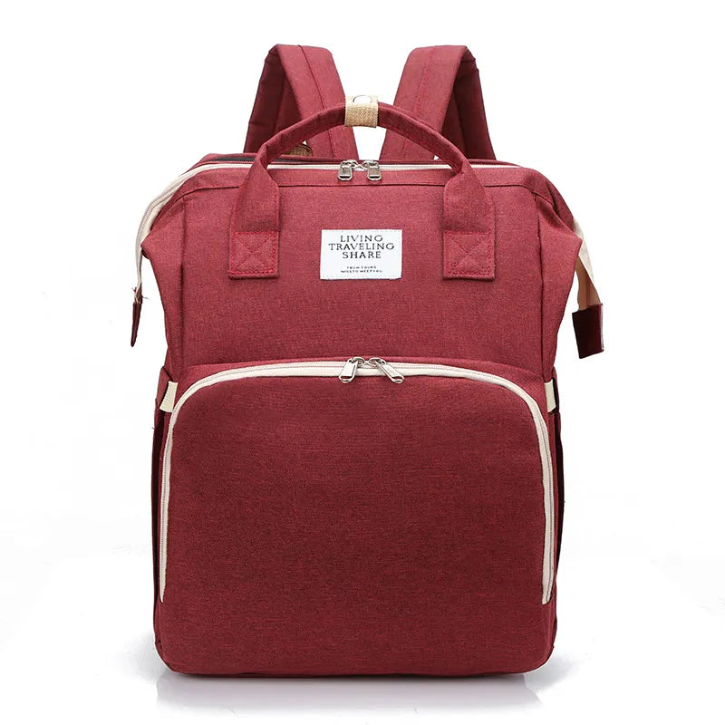 Grand sac à maman à grande capacité de la marque Boutique Angenor, avec plusieurs compartiments et poches pour accessoires.