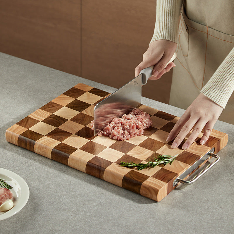 Planche à découper en acacia Mango de Boutique Anenor, surface lisse avec poignées pour la préparation des aliments.