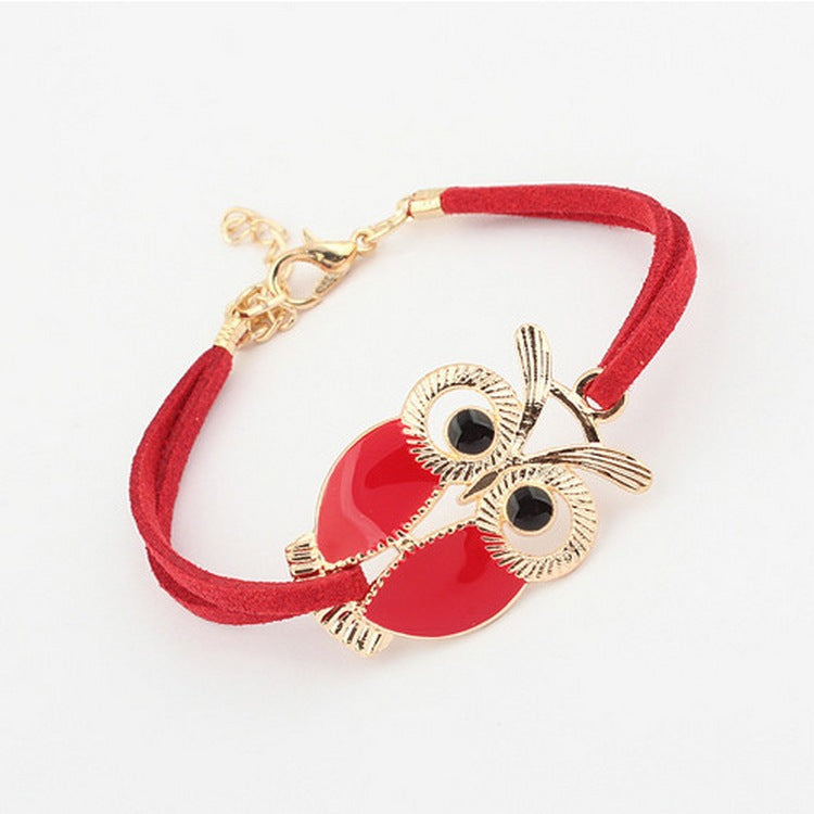 Bracelet en cuir coloré en forme de chouette, accessoire de mode unique avec détails colorés et artisanal.
